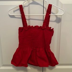 Red cinched peplum tank top with open back